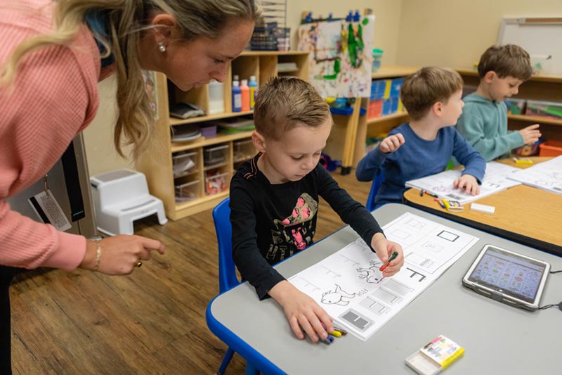 Meredith Student working with children.